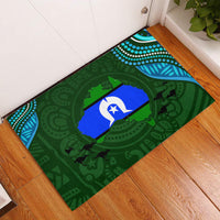 Green rubber doormat with Aboriginal-style island pattern and blue star motif, rectangular
