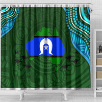 Green shower curtain with central blue flag emblem and decorative turquoise dotwork borders
