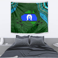 Green Aboriginal pattern tapestry with central star and animal silhouettes, hanging above bed