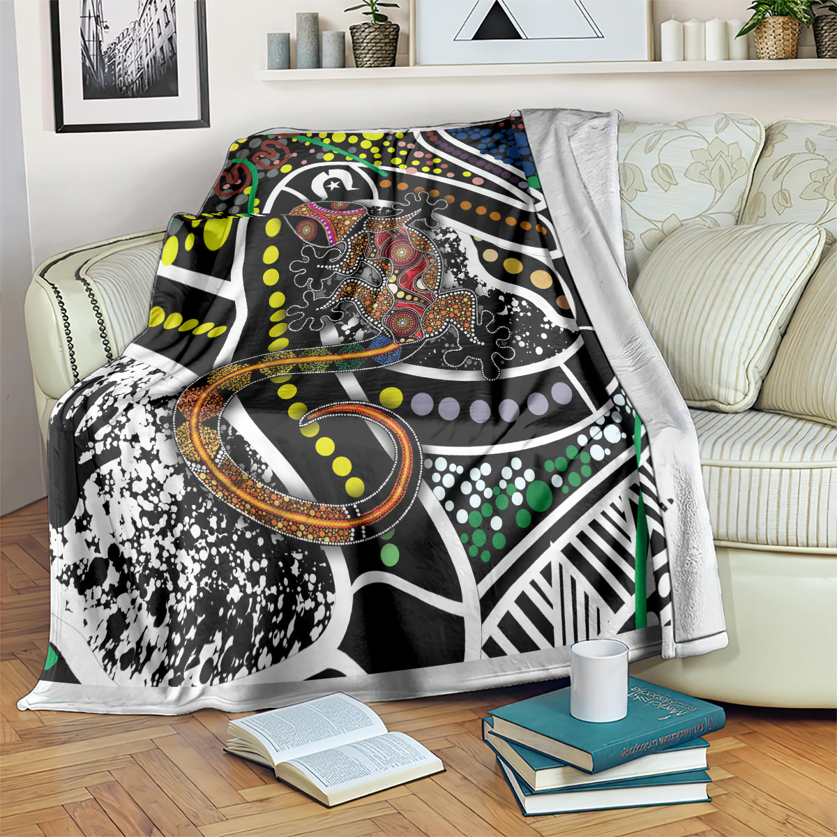 Lizard dot art blanket over a sofa, multicolor dots and a patterned lizard illustration