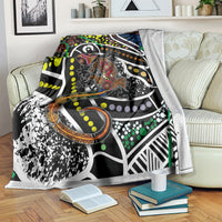 Lizard dot art blanket over a sofa, multicolor dots and a patterned lizard illustration