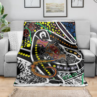 Lizard dot art blanket with black, white, green, yellow, orange, and purple geometric shapes