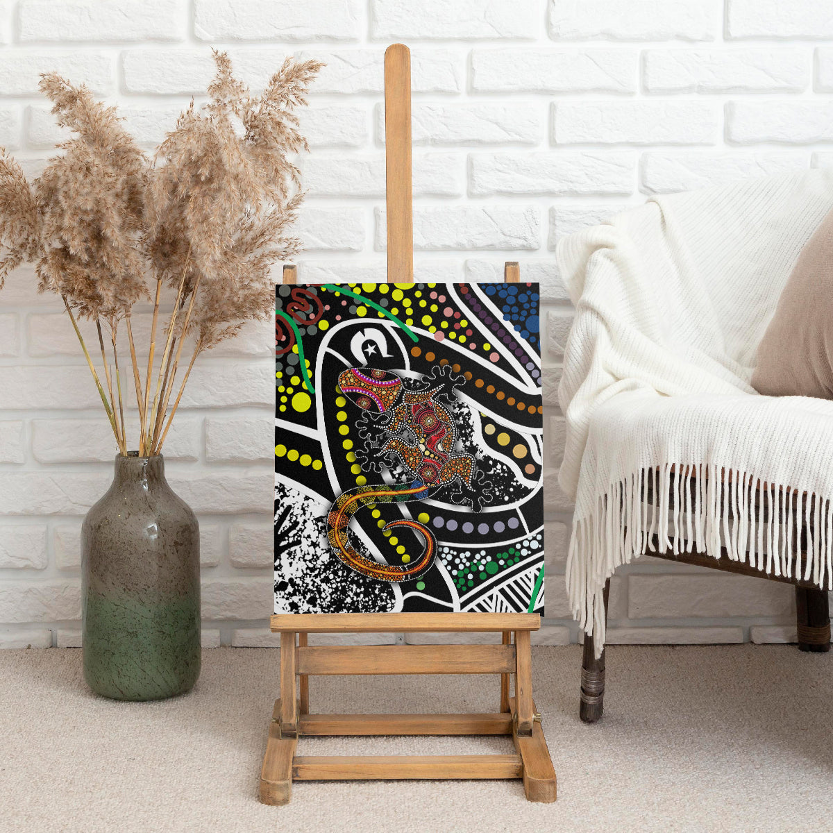 Multicolor lizard pattern canvas wall art displayed on an easel, dot and striped accents.