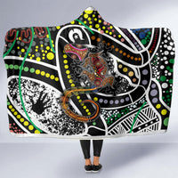 Multicolor hooded blanket with bold Aboriginal-style dot and animal graphic, front view