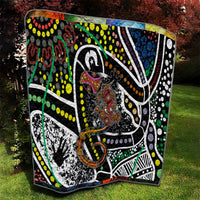 Multicolor Aboriginal lizard pattern dot art quilt laid on grass in a yard