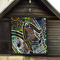Multicolor Aboriginal lizard pattern dot art quilt hanging on a wooden shed wall