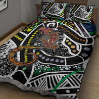 Multicolor lizard pattern quilt with two pillows, orange and green accents on black