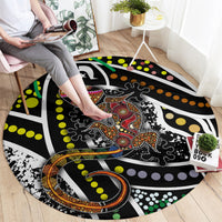 Round lizard pattern carpet with multicolor dot swirls, shown flat on a wood floor