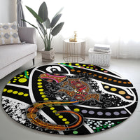Round lizard pattern area rug with multicolor dot art on black and a central lizard motif