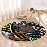 Round lizard-dot art rug, black base with bright green, yellow, orange and purple dots