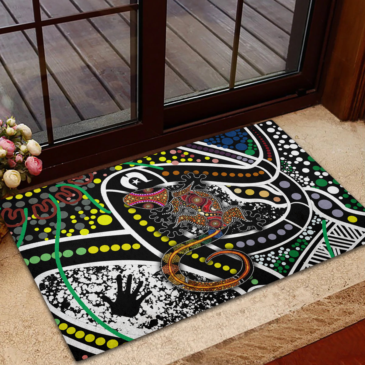 Multicolor rubber doormat with Aboriginal lizard motif, circular orange ring detail, abstract dots
