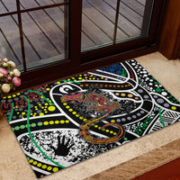 Multicolor rubber doormat with Aboriginal lizard motif, circular orange ring detail, abstract dots