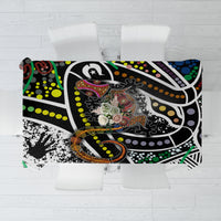 Folded multicolor tablecloth showing bold black-and-white pattern with green and orange accents