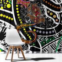 Close-up of multicolor Aboriginal dot art curtain fabric with black, white, and green details.