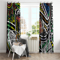 Multicolor Aboriginal dot art window curtains with patterned borders, hanging in a sunlit room.