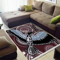 Aboriginal bird area rug with maroon base, black outlines, blue wings, and dot details