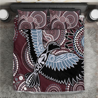 Bird patterned bedding set with maroon, black, and light blue fabric and two matching pillowcases