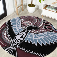 Round Aboriginal pattern bird rug with black, maroon, light blue, and white graphics