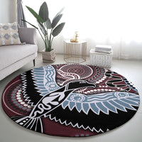 Round Aboriginal pattern bird rug featuring dot medallion and bird illustration in blue/black