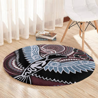 Round Aboriginal pattern bird rug with bird and dot ring designs in black, maroon, and light blue