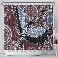 Bird shower curtain with maroon, black, and light blue dot-and-ring motifs