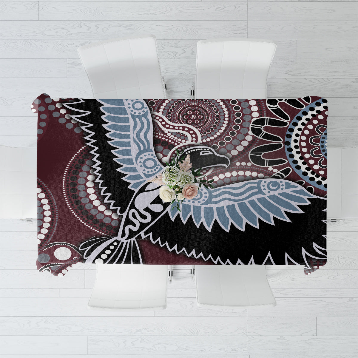 Bird-inspired Aboriginal pattern tablecloth with maroon, black, blue, and white motifs.