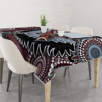 Bird-pattern tablecloth on a dining table with maroon, black, blue, and white circles and lines.