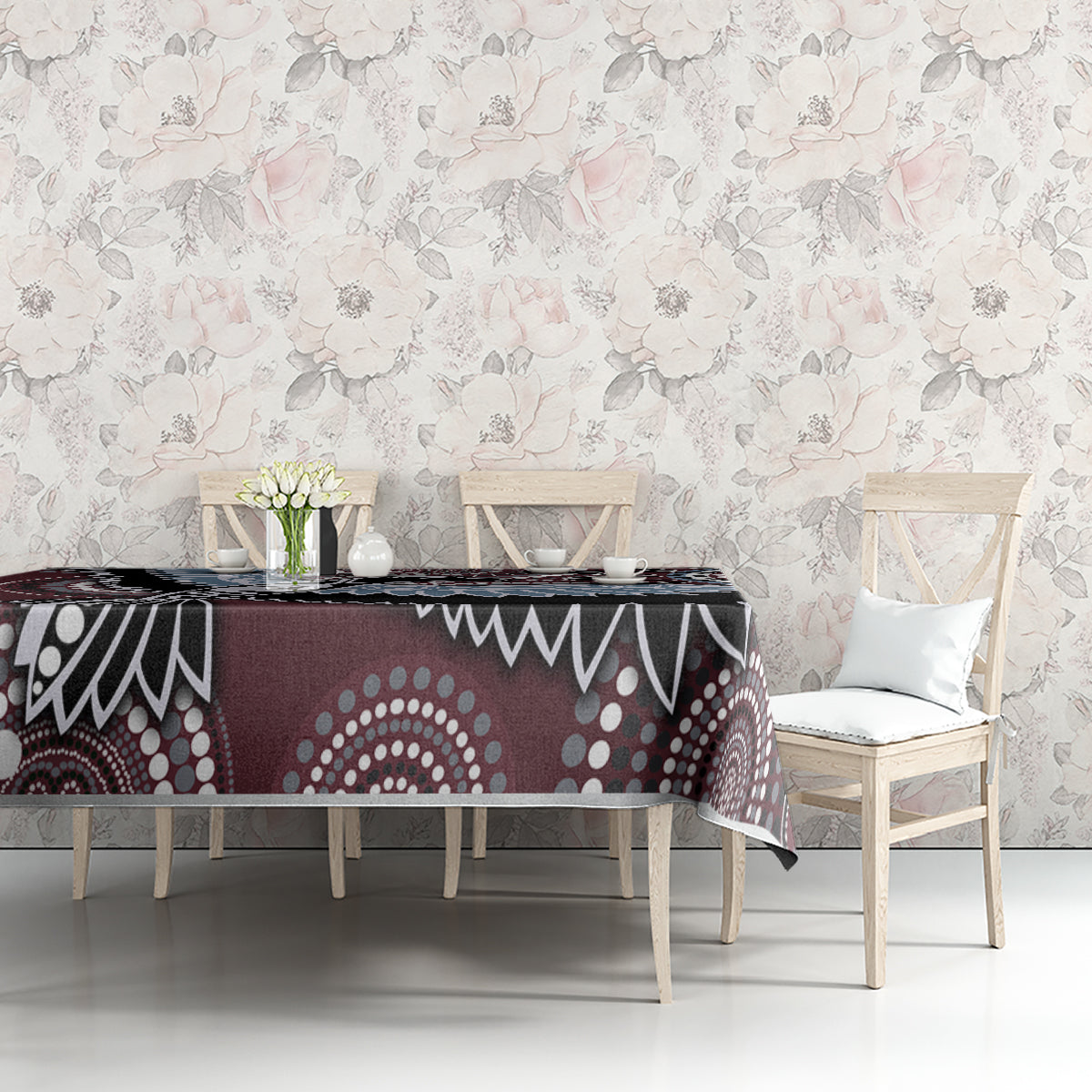 Bird-inspired Aboriginal pattern tablecloth on table in maroon, black, blue, and white geometric print.