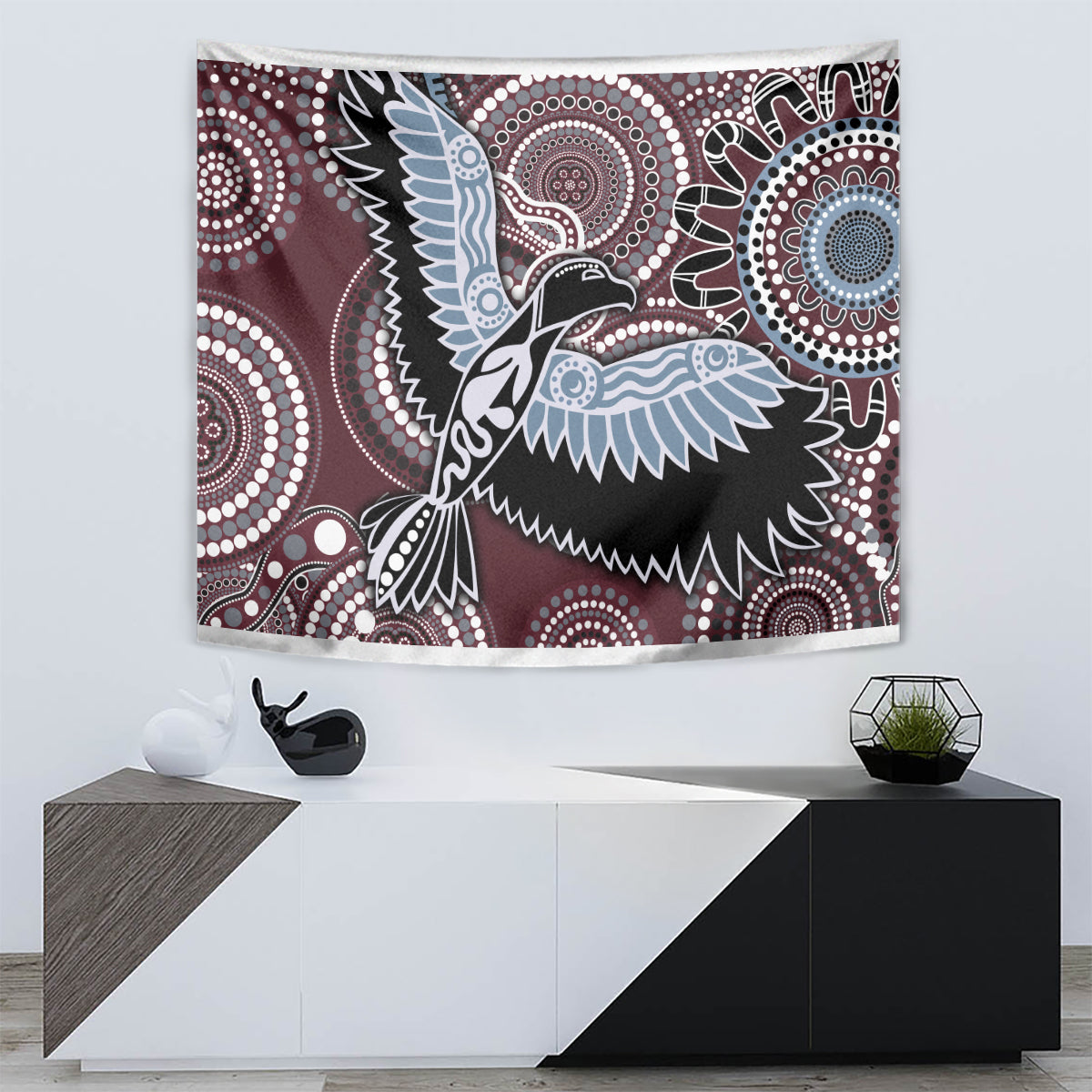 Maroon wall tapestry with blue bird silhouette and white circular dotwork ornamentation