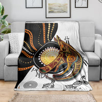 Multicolor kangaroo pattern throw blanket folded over a sofa back, white and dark sections