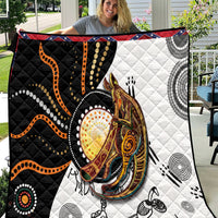 Quilt close-up featuring orange dotted waves and centered kangaroo face on black/white panels