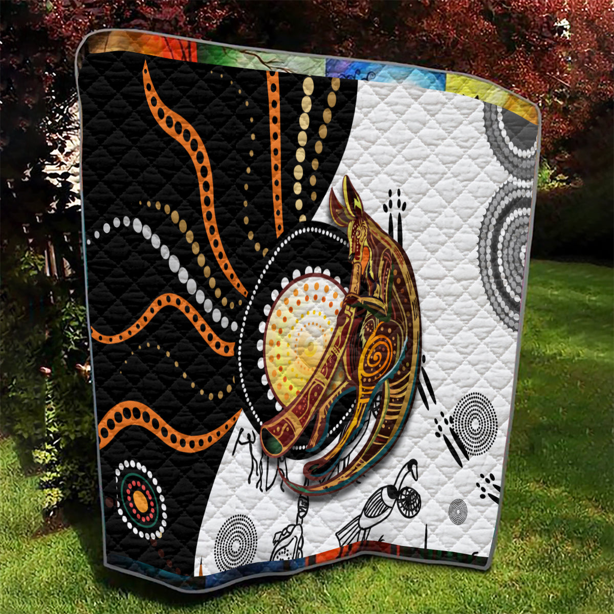 Quilt with black and white background, orange dotted lines, and detailed kangaroo portrait