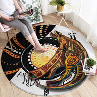 Round rug with black, orange, yellow dotwork and kangaroo graphic, full view