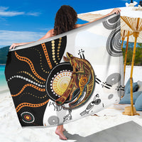 Multicolor dot art sarong with stylized animal face and swirled lines on black and white