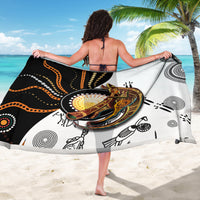 Dot art sarong draped over shoulders, black and white with multicolor central animal