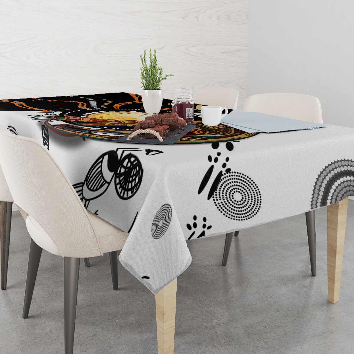 Tablecloth with gray and black dot-art circles and paw-print accents in Aboriginal style