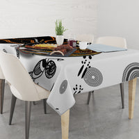 Tablecloth with gray and black dot-art circles and paw-print accents in Aboriginal style