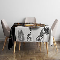 Black and white Aboriginal kangaroo dot-art tablecloth on a square table with chair covers