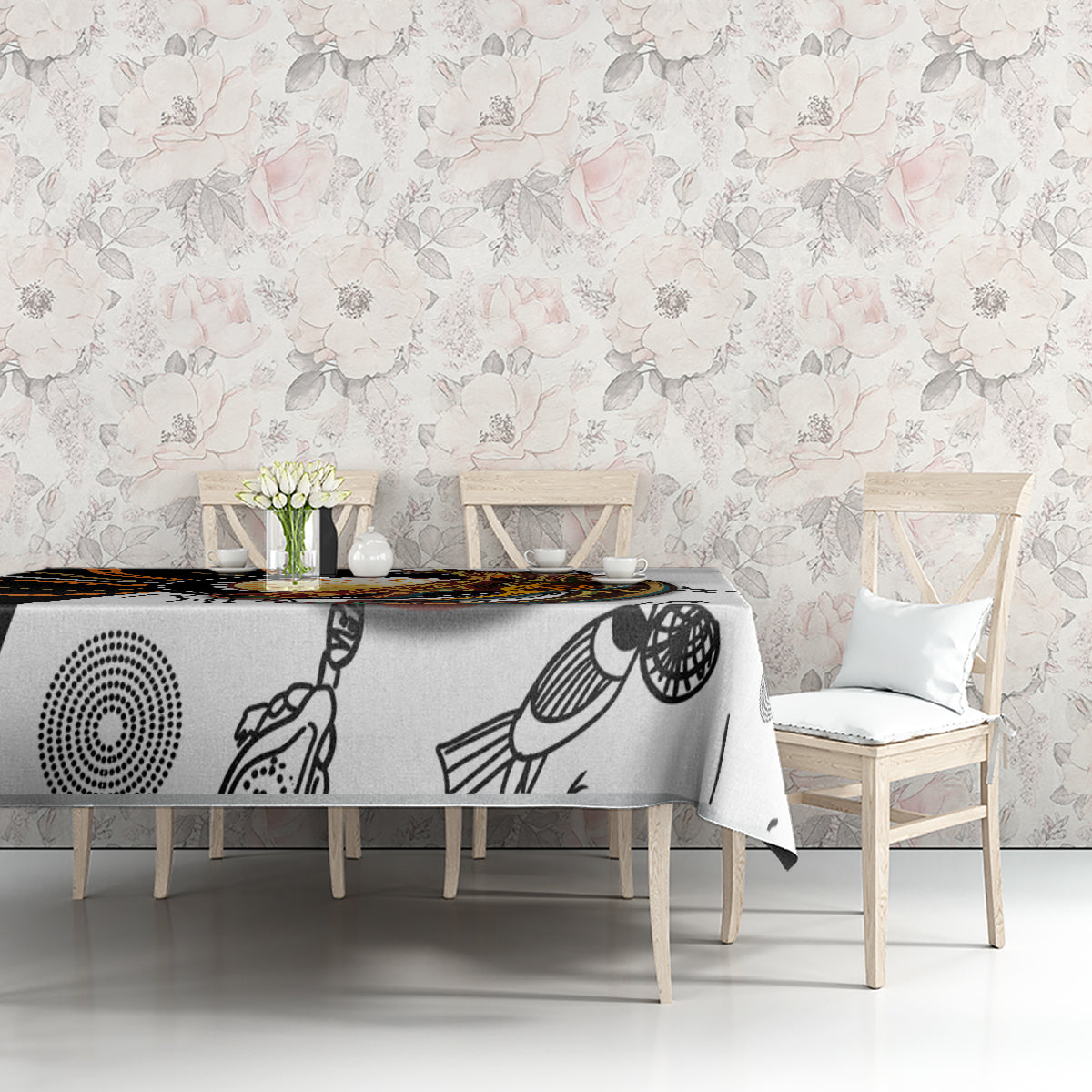 Long tablecloth with Aboriginal dot-art circles and bird-like figure linework in black and white