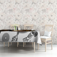 Long tablecloth with Aboriginal dot-art circles and bird-like figure linework in black and white