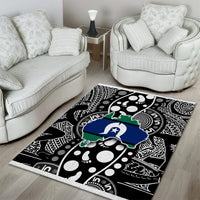 Abstract map-pattern area rug with black and white geometric dots, plus blue and green motif.