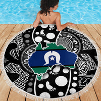 Round beach blanket with white fringe edge, blue Australia map over black dot pattern