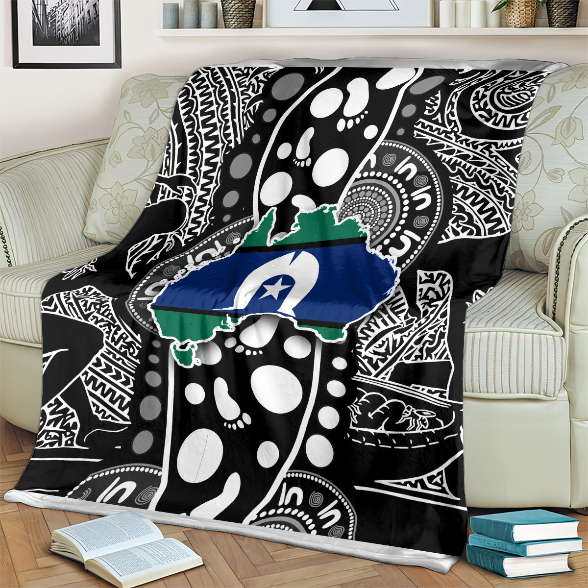 Close view of Aboriginal pattern blanket on couch, black, white, green, and blue map artwork