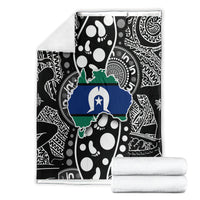 Folded Aboriginal pattern blanket, black and white with green and blue Australia map print