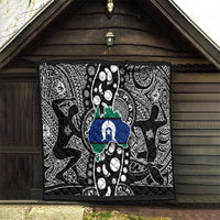 Aboriginal pattern quilt hanging on wall, black-and-white tribal print with blue star map