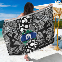 Black patterned sarong with white, green, and blue map motifs, laid flat