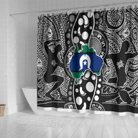 Long shower curtain with multicolor map emblem on black-and-white tribal pattern