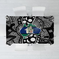 Aboriginal patterned tablecloth in black with white motifs and blue-green island design