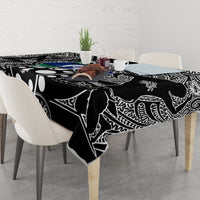 Aboriginal patterned tablecloth, black with white linework and blue-green motif across top