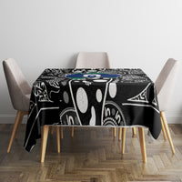 Aboriginal patterned tablecloth, black with bold white central motif and blue-green accents